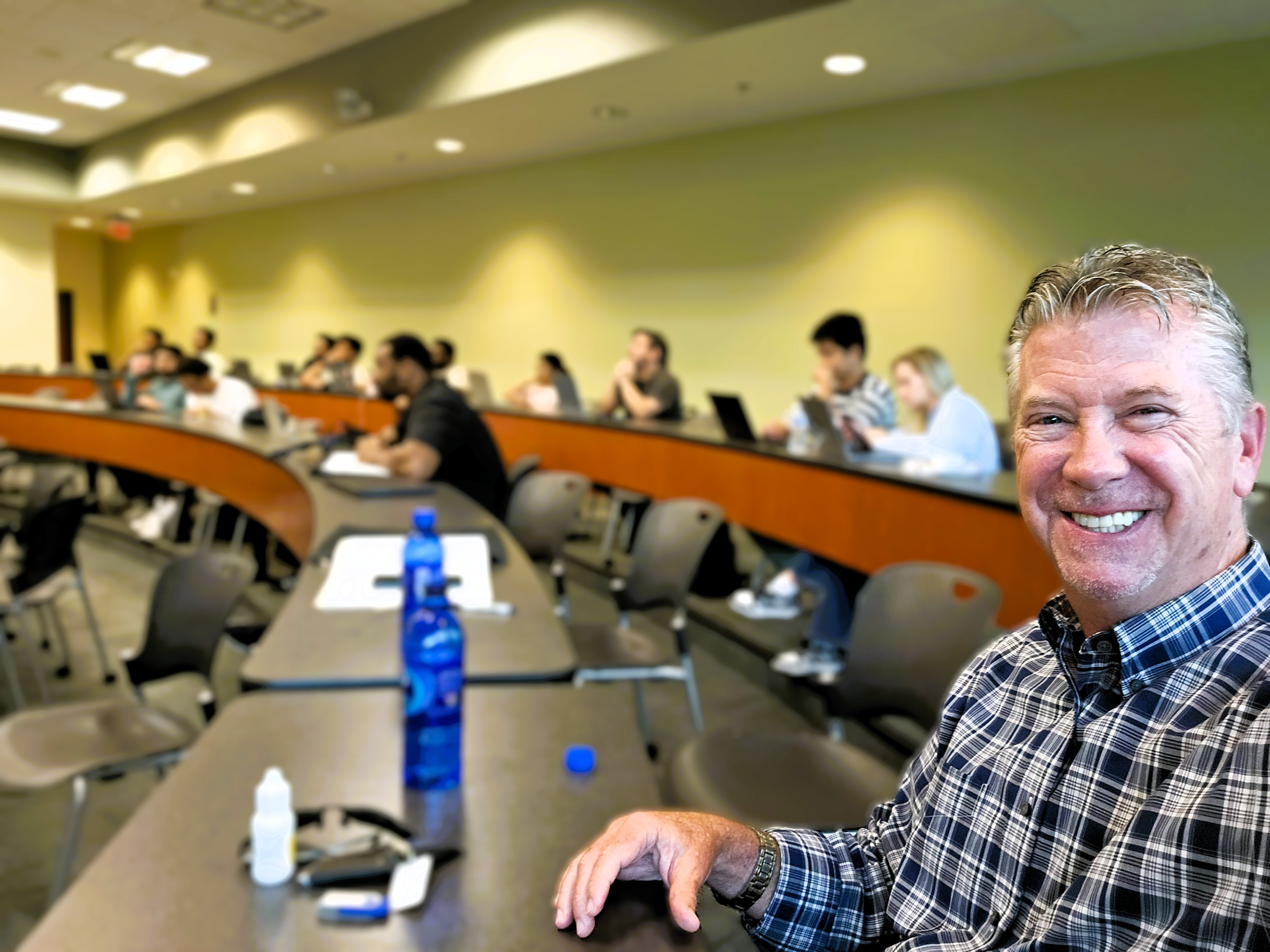 Bob Crews enjoying his time in class before his latest USF presentation.